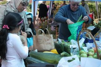 Local residents buying produce grown at the allotment.