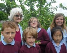 Mary Eastwood with pupils from Heyes Lane School.