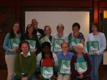 Strong Roots participants with their information packs.