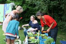 Jo and Sally tempting the kids with salad